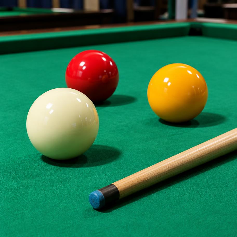 Biljartballen op groen laken
